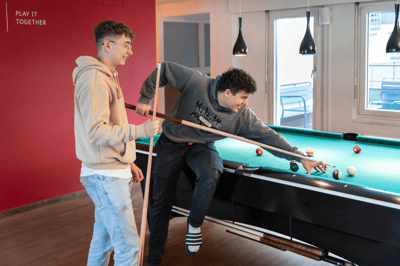 Two Leuchter apprentices playing billiards