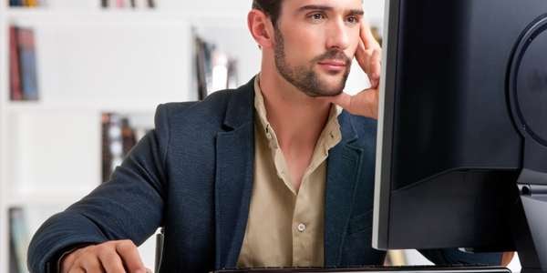 A person in front of the PC. 