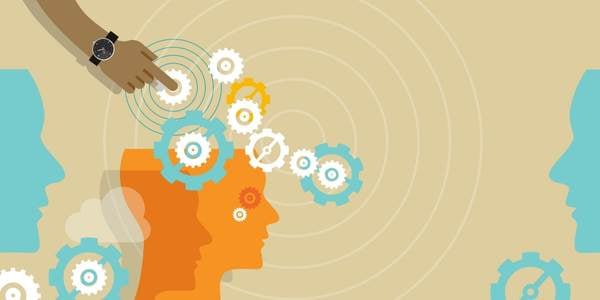 Knowledge transfer with graphic cogwheels and abstracted heads as a symbol for digital learning